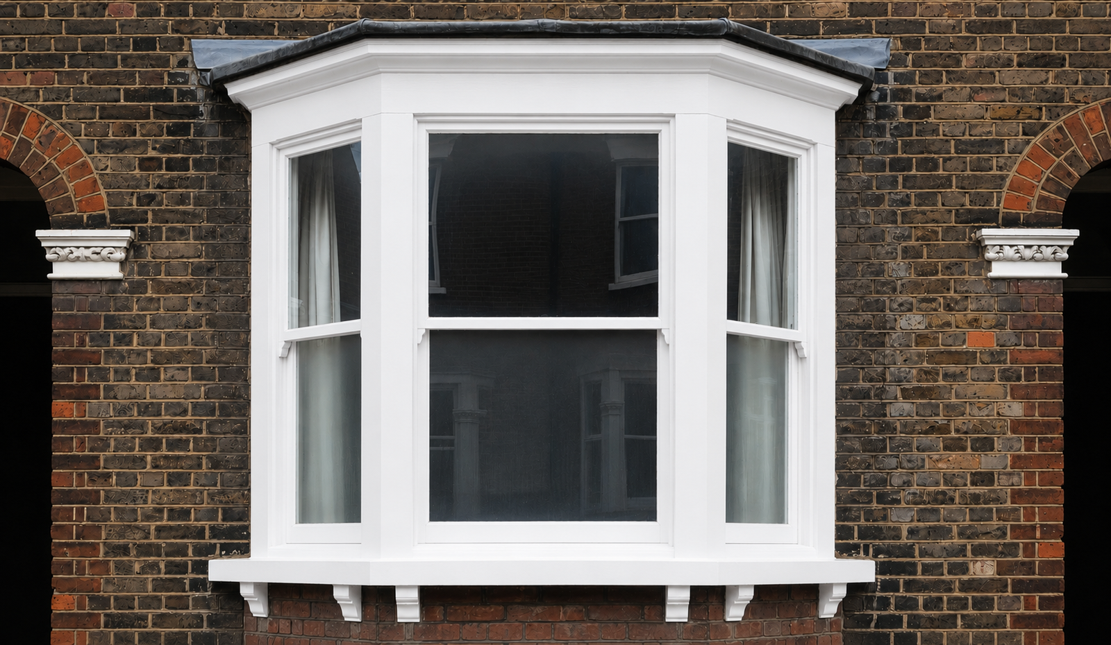 Completed white timber sash bay window replacement