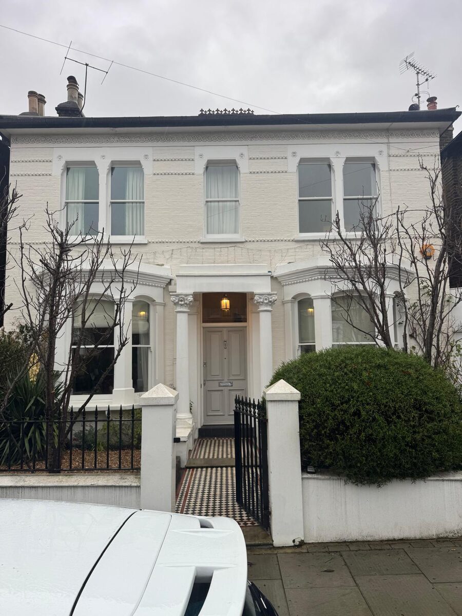 White Victorian villa in South West London with restored timber sash windows and bays